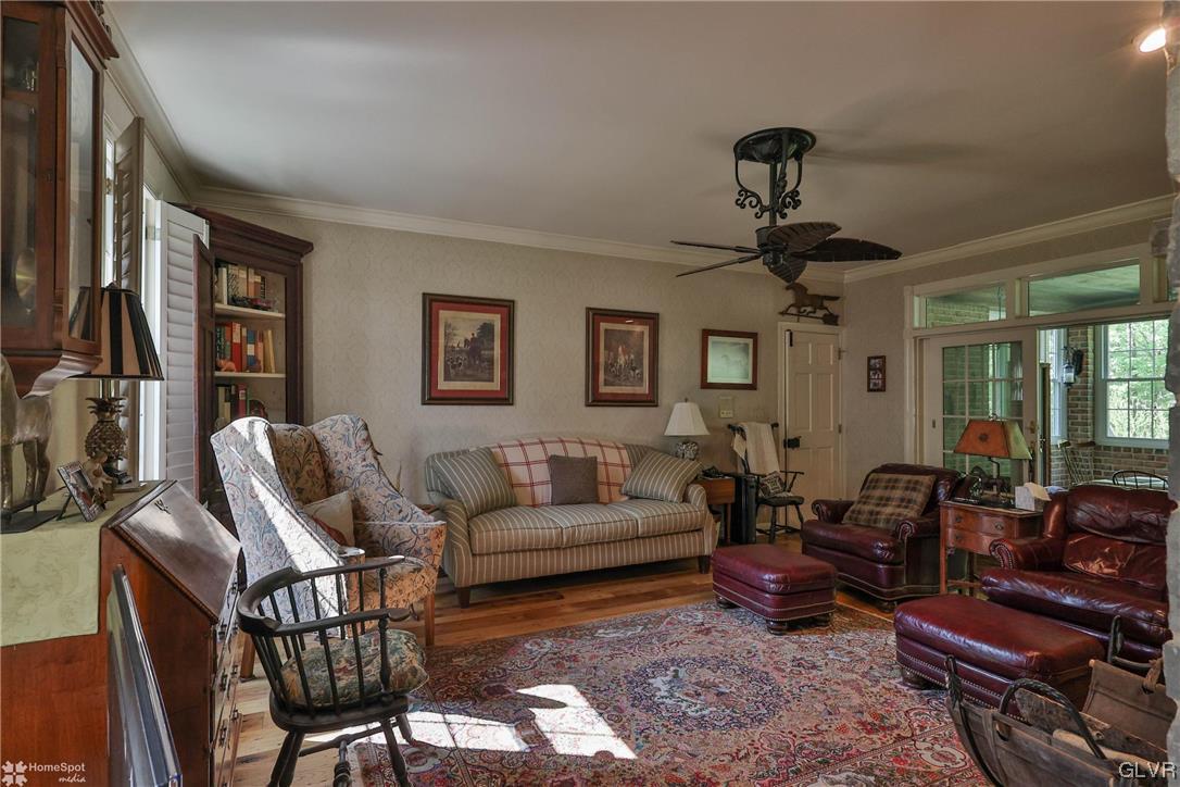 182 Baron Road Wind Gap, PA 18091 - Photo 9 of 49 a living room with furniture a ceiling fan and a window