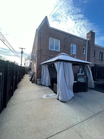 a view of backyard with outdoor seating