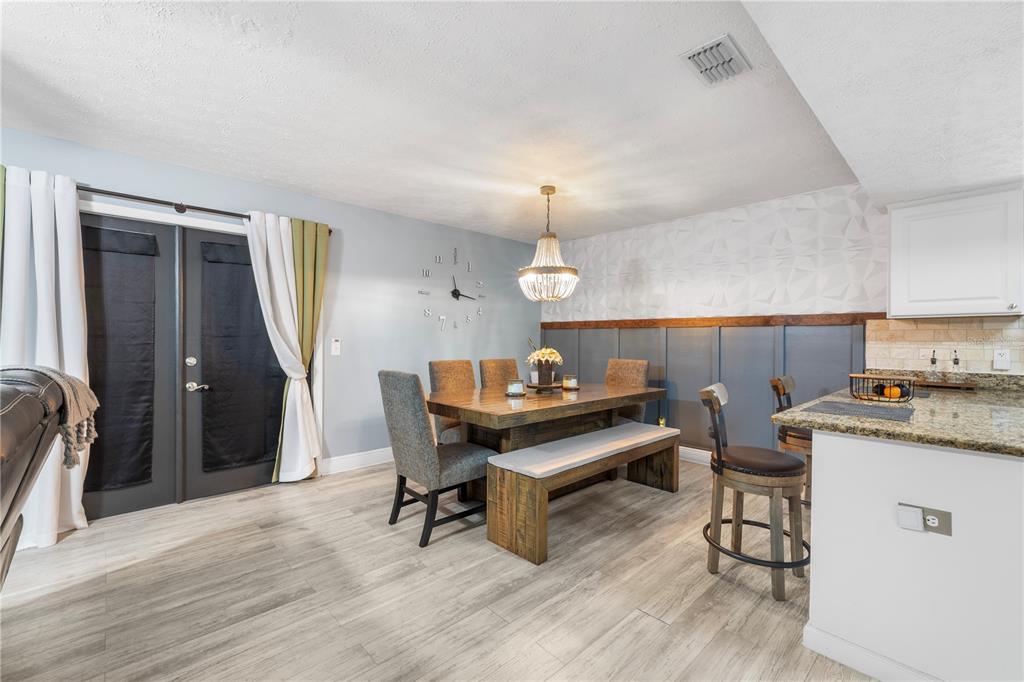 1005 Mook Street Brandon, FL 33510 - Photo 11 of 48 a living room with furniture and a wooden floor