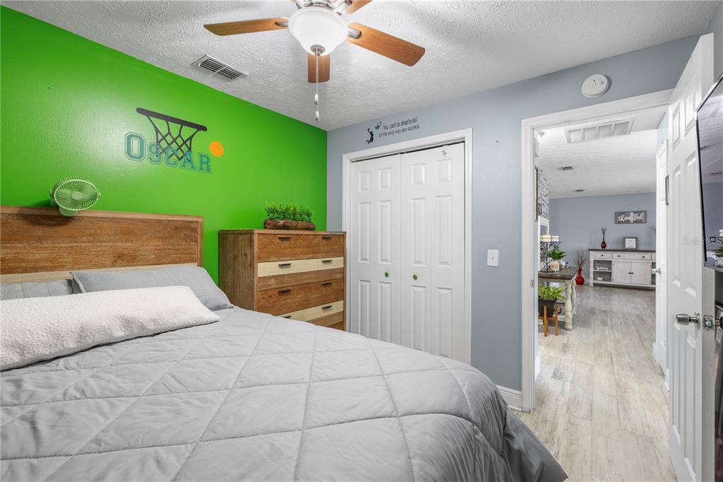 1005 Mook Street Brandon, FL 33510 - Photo 20 of 48 a bedroom with a bed and a large mirror