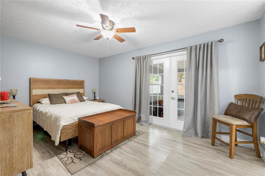 1005 Mook Street Brandon, FL 33510 - Photo 25 of 48 a bedroom with a bed and chair