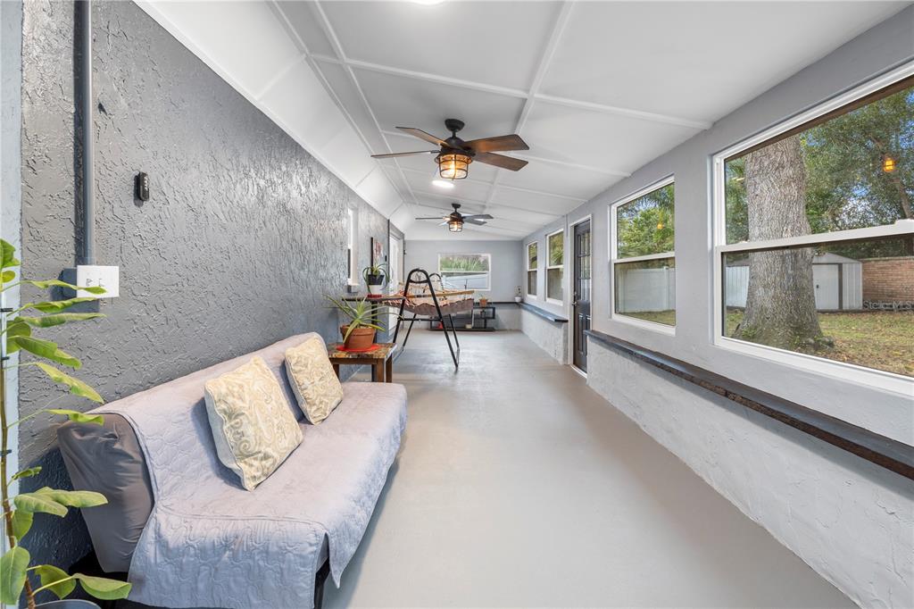 1005 Mook Street Brandon, FL 33510 - Photo 31 of 48 a living room with furniture and a large window