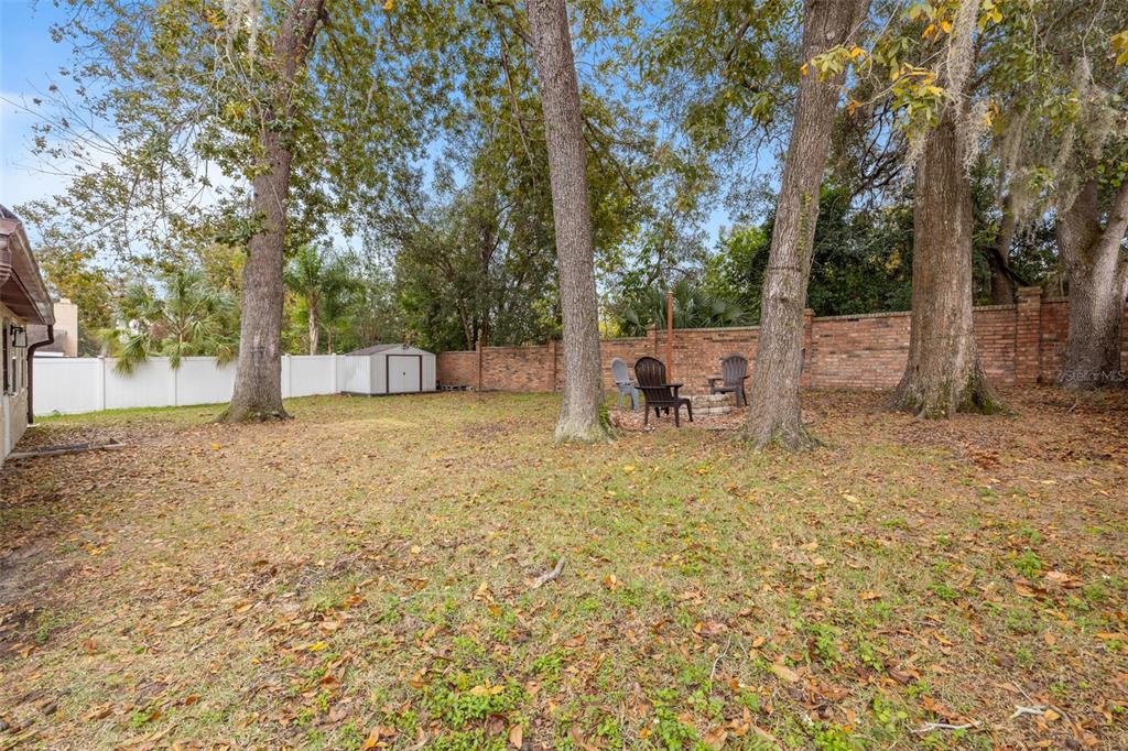 1005 Mook Street Brandon, FL 33510 - Photo 37 of 48 a backyard of a house with table and chairs