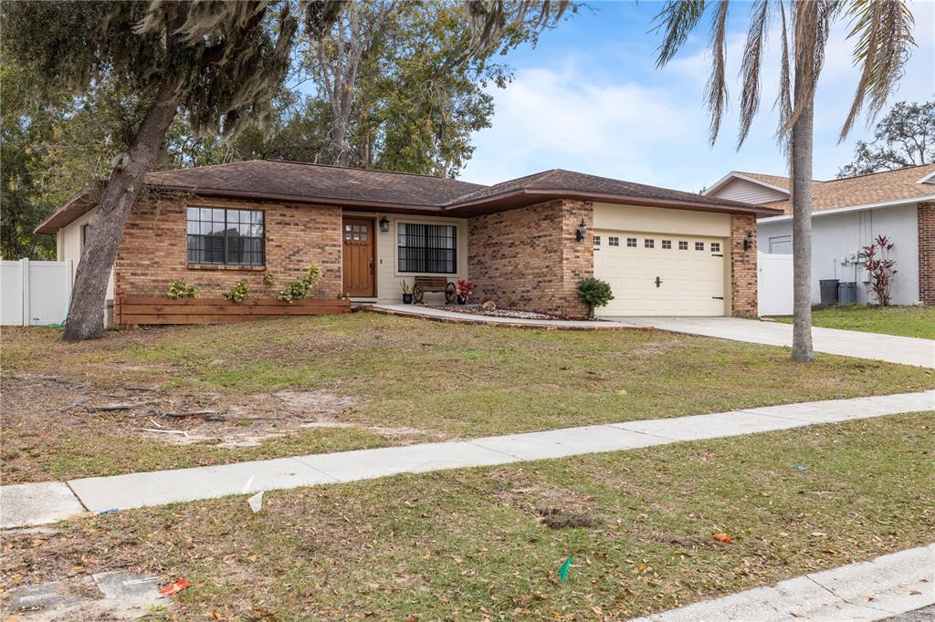 1005 Mook Street Brandon, FL 33510 - Photo 39 of 48 a view of a house with a swimming pool