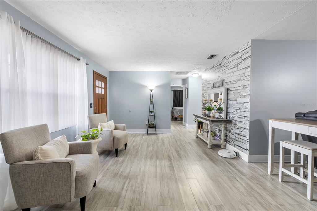 1005 Mook Street Brandon, FL 33510 - Photo 5 of 48 a living room with furniture and a wooden floor