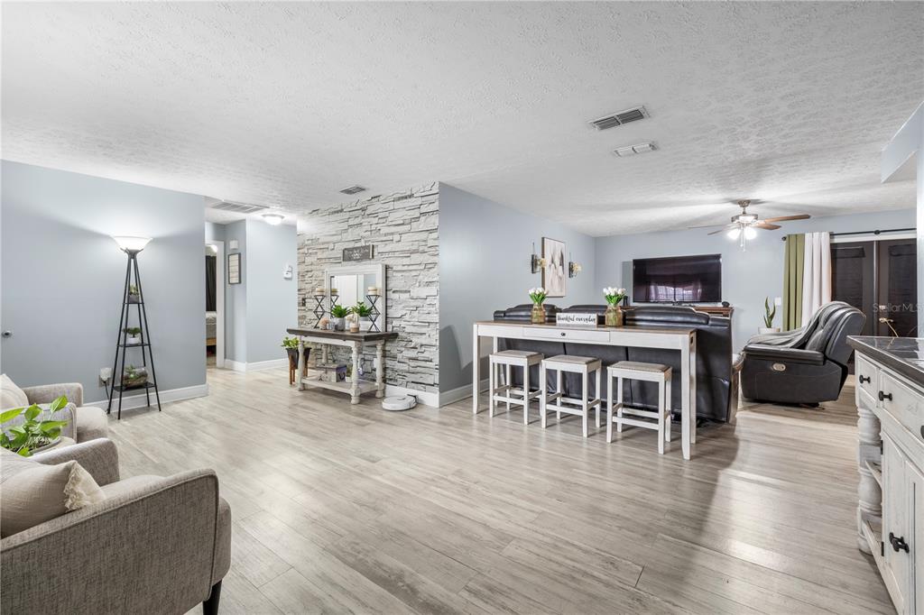 1005 Mook Street Brandon, FL 33510 - Photo 6 of 48 a living room with furniture and kitchen view