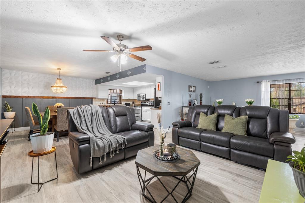 1005 Mook Street Brandon, FL 33510 - Photo 8 of 48 a living room with furniture kitchen view and wooden floor