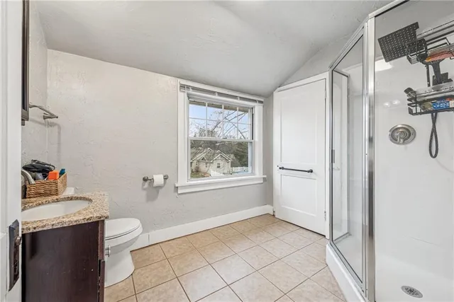 a view of a room that has a window and storage in it