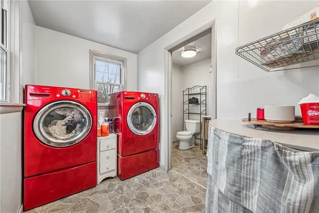 a view of storage and utility room with washer and dryer