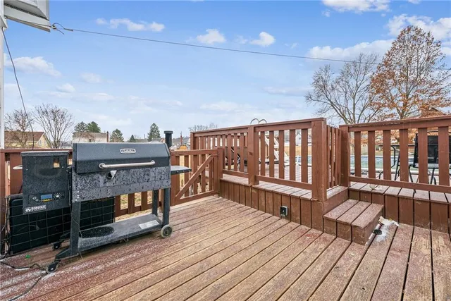 a balcony with wooden floor