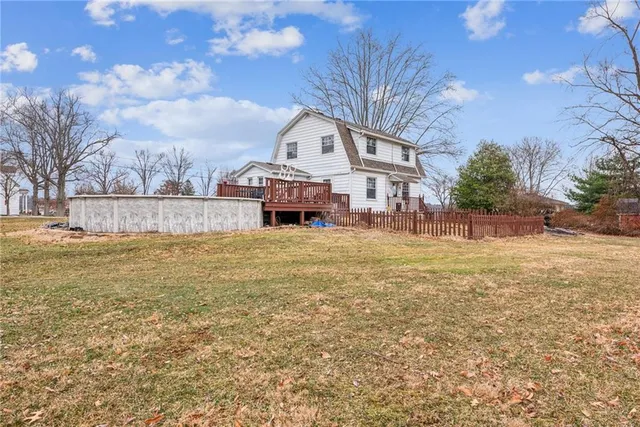 a large tree in front of a house