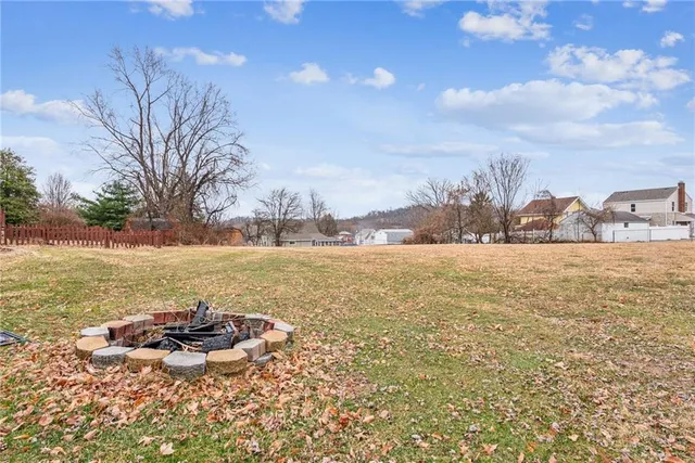 a view of a lake with houses in the back