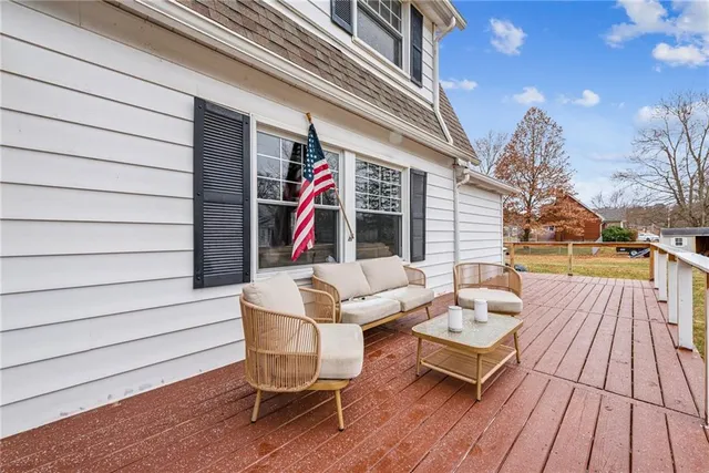 a view of a chairs and table on the deck