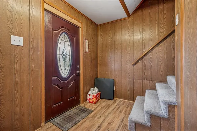 a front view of a house with wooden floor