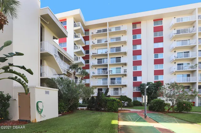 a front view of a building with garden