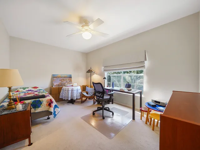 a view of a livingroom with furniture and a window
