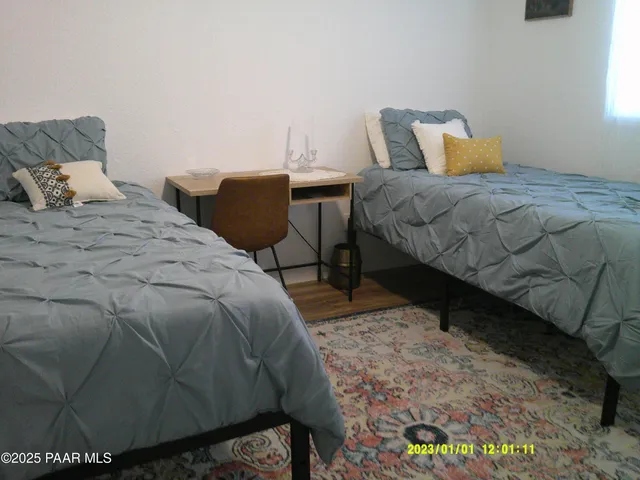 a bedroom with a bed and window