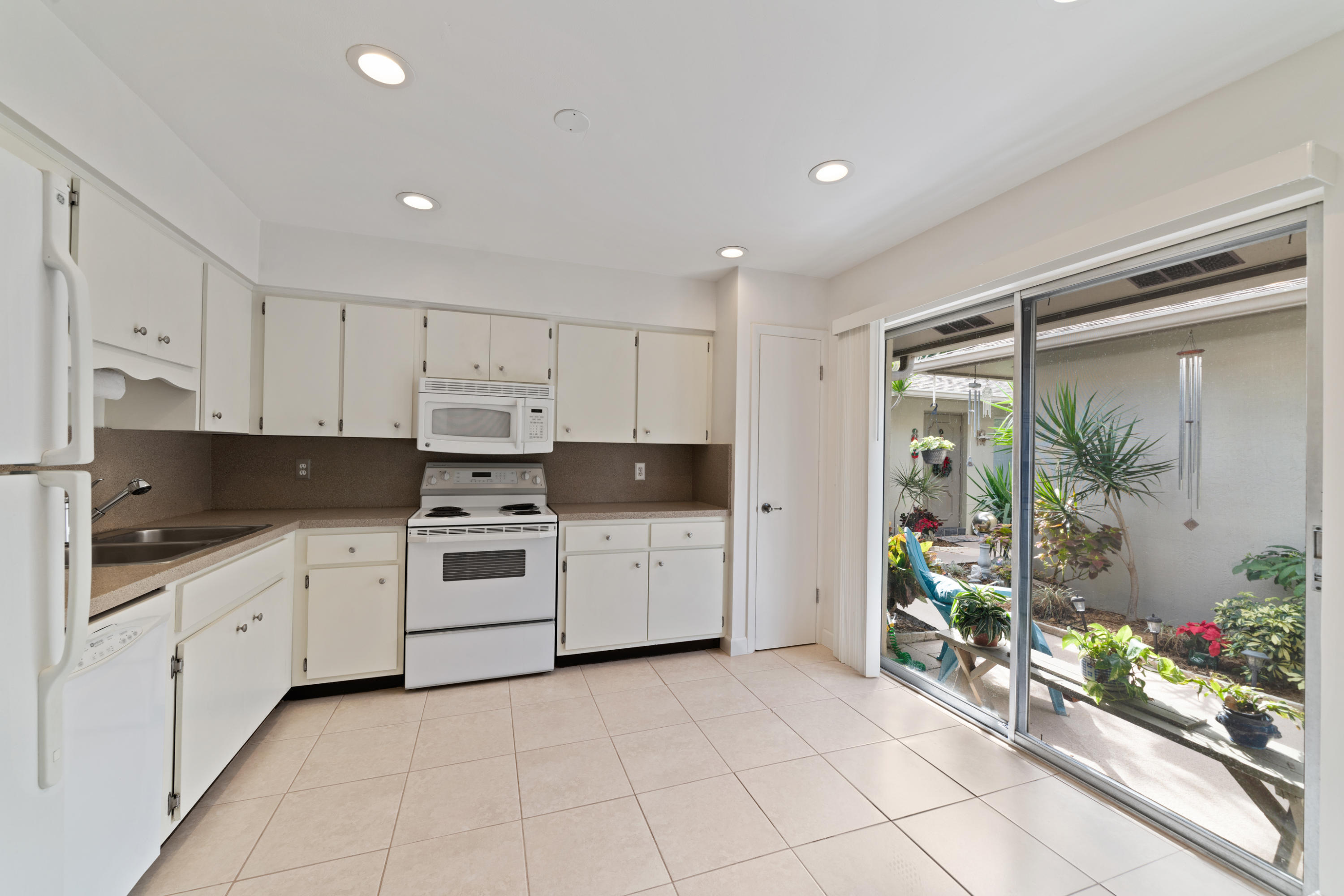 2016 Joy-Rene Lane North Palm Beach, FL 33408 - Photo 16 of 24 2/1 UNITS #2,3,4 KITCHEN