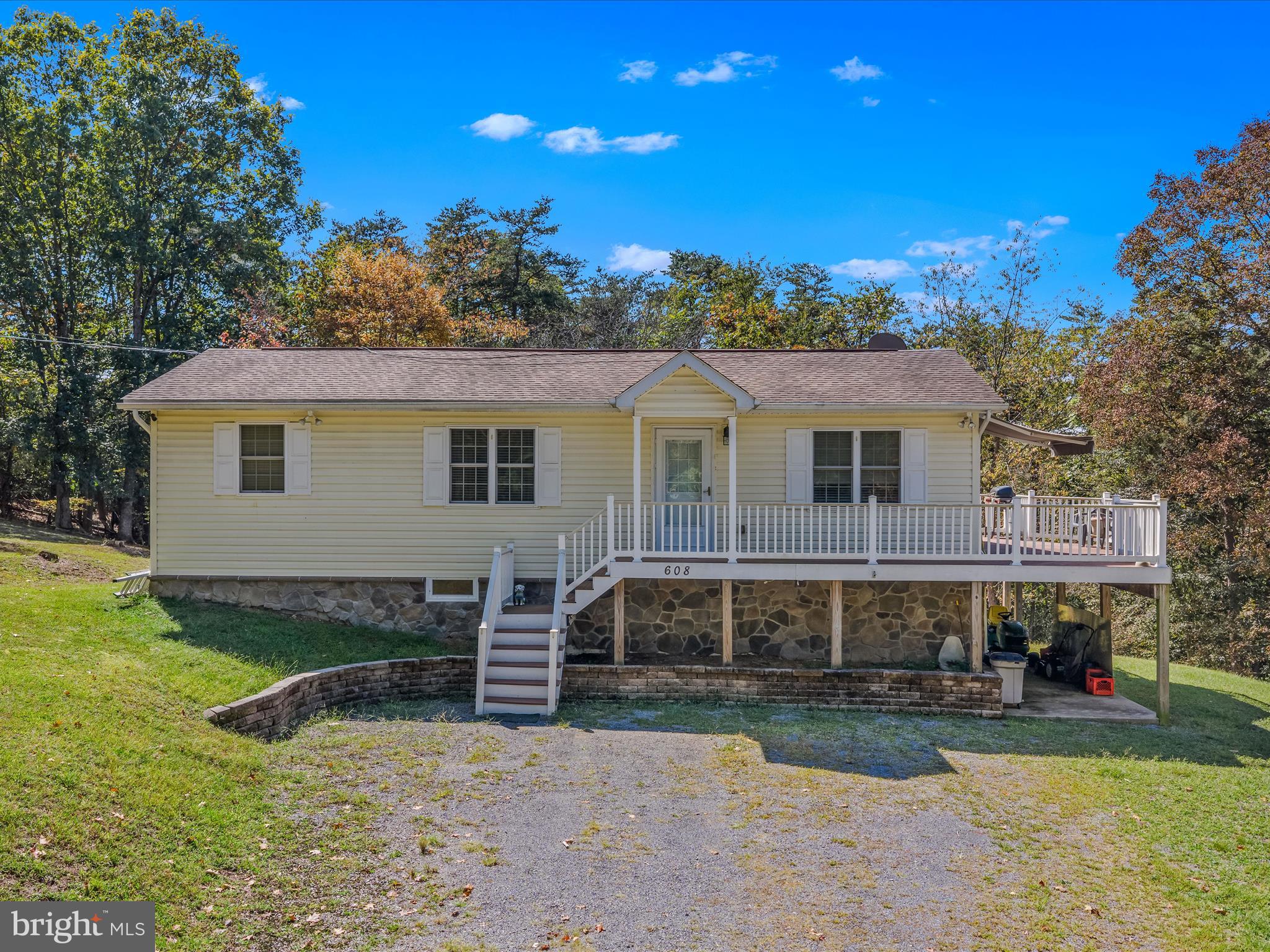 a view of a house with a yard porch and sitting area
