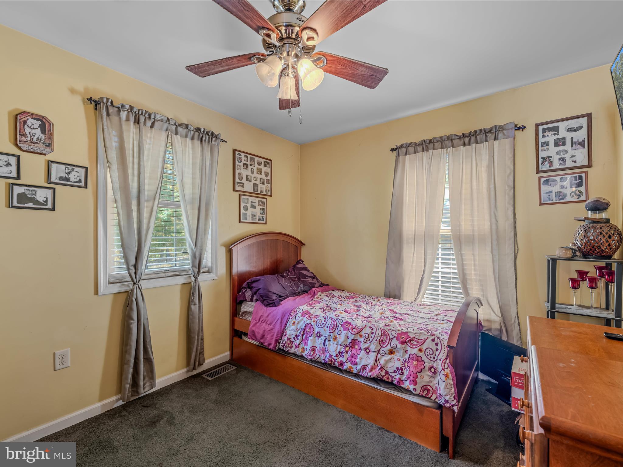 608 DeHaven Road Berkeley Springs, WV 25411 - Photo 16 of 52 a bedroom with a bed and a chandelier