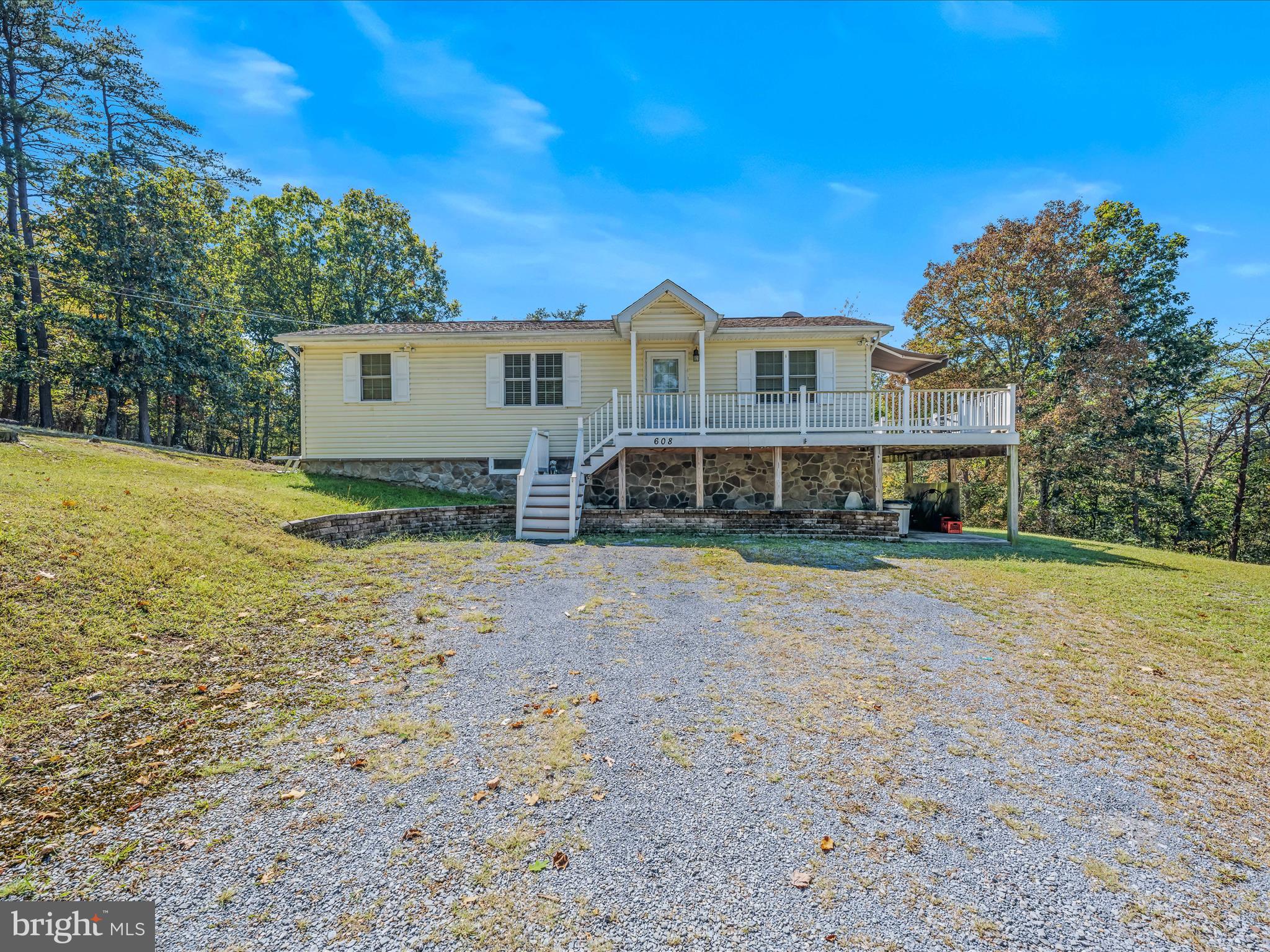 608 DeHaven Road Berkeley Springs, WV 25411 - Photo 30 of 52 a view of a house with a yard