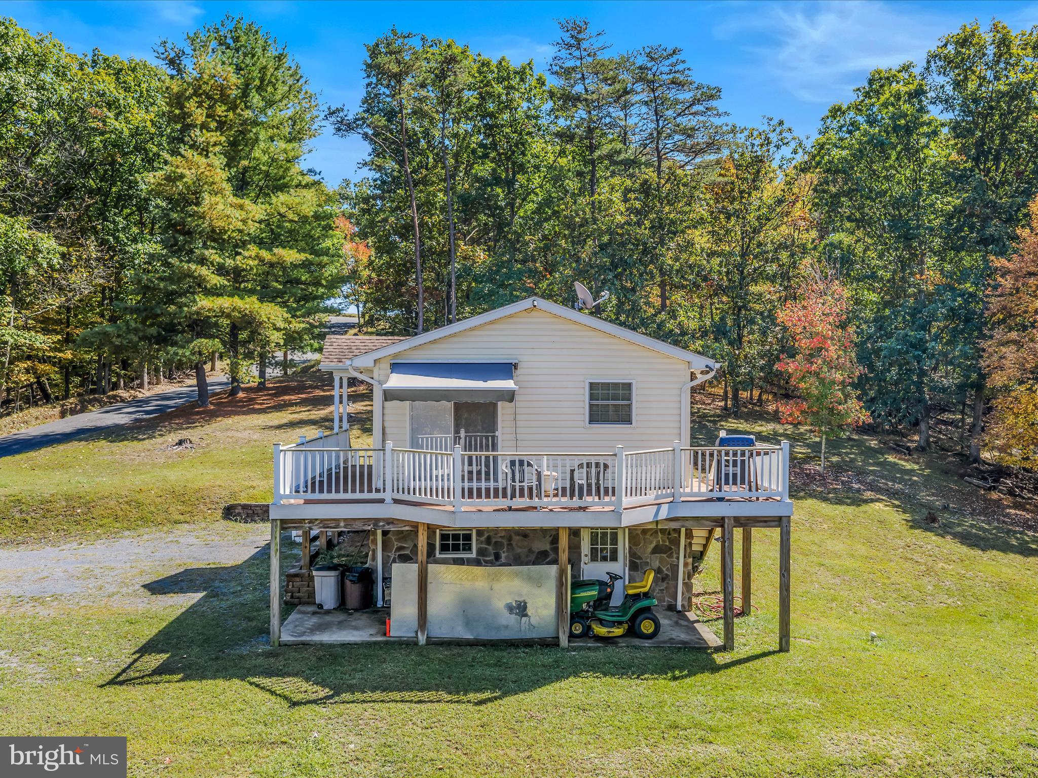 608 DeHaven Road Berkeley Springs, WV 25411 - Photo 32 of 52 a view of a house with pool and sitting area