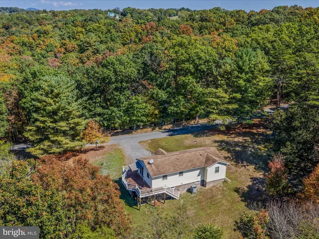 a view of a swimming pool with a yard