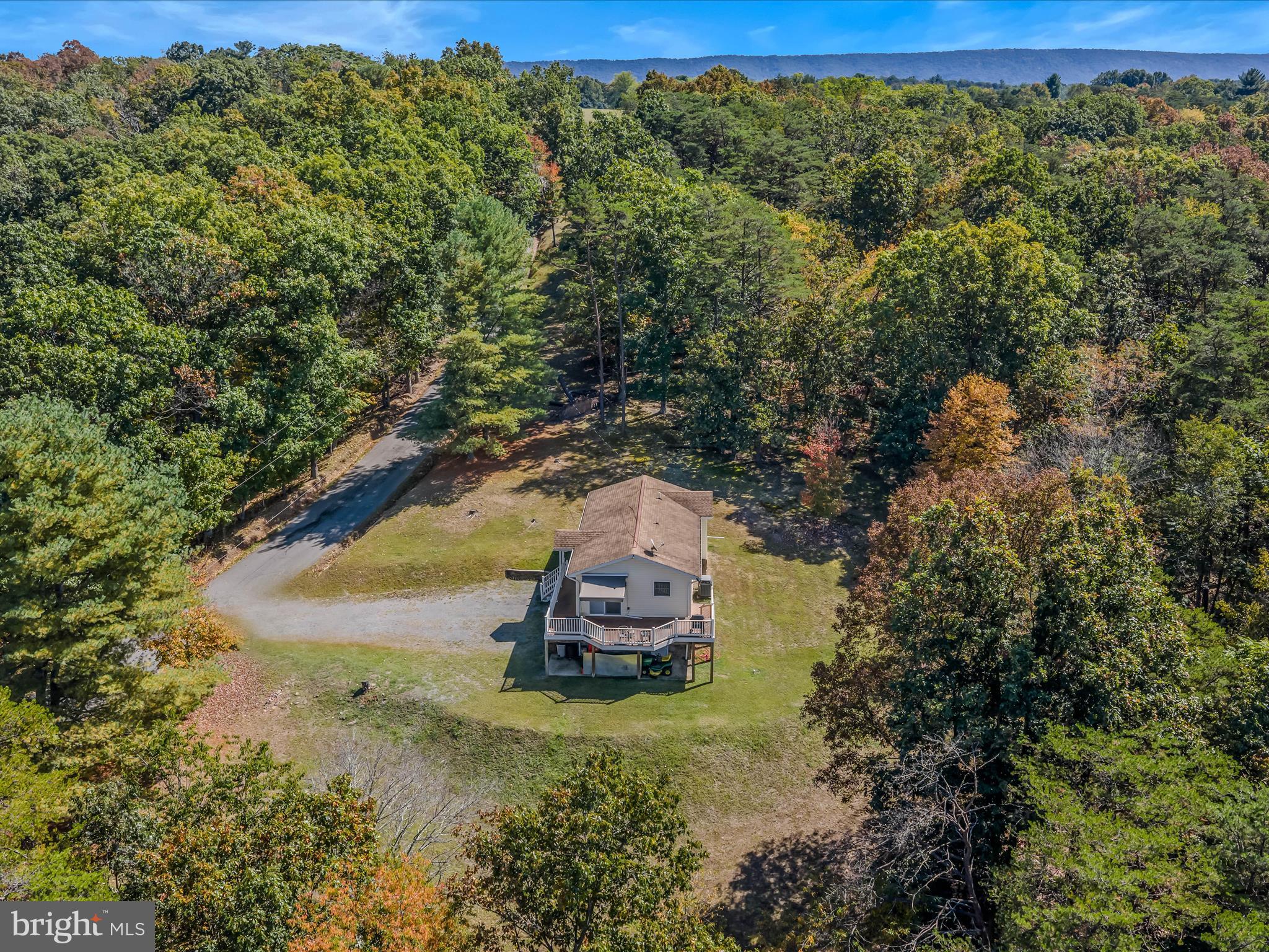 608 DeHaven Road Berkeley Springs, WV 25411 - Photo 36 of 52 a view of a yard with a tree