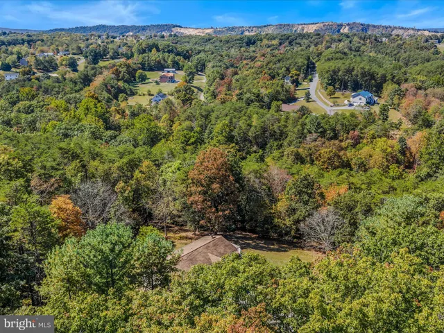 a view of a yard with a building in the background