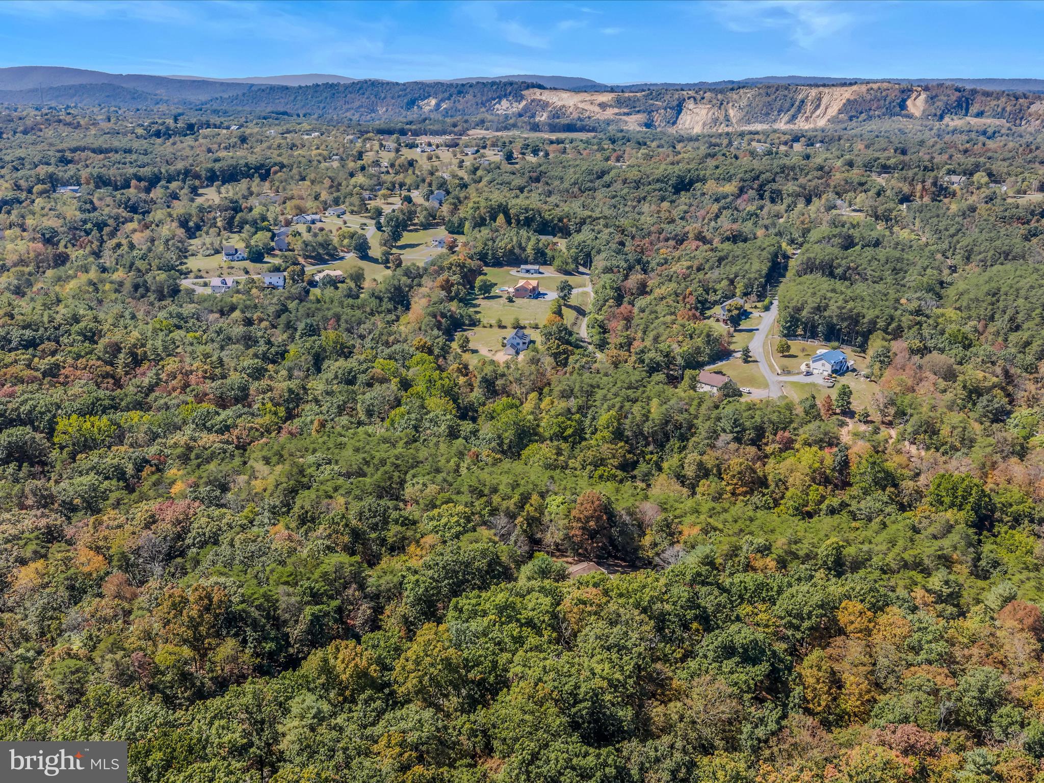 608 DeHaven Road Berkeley Springs, WV 25411 - Photo 52 of 52 a view of a city with lush green forest
