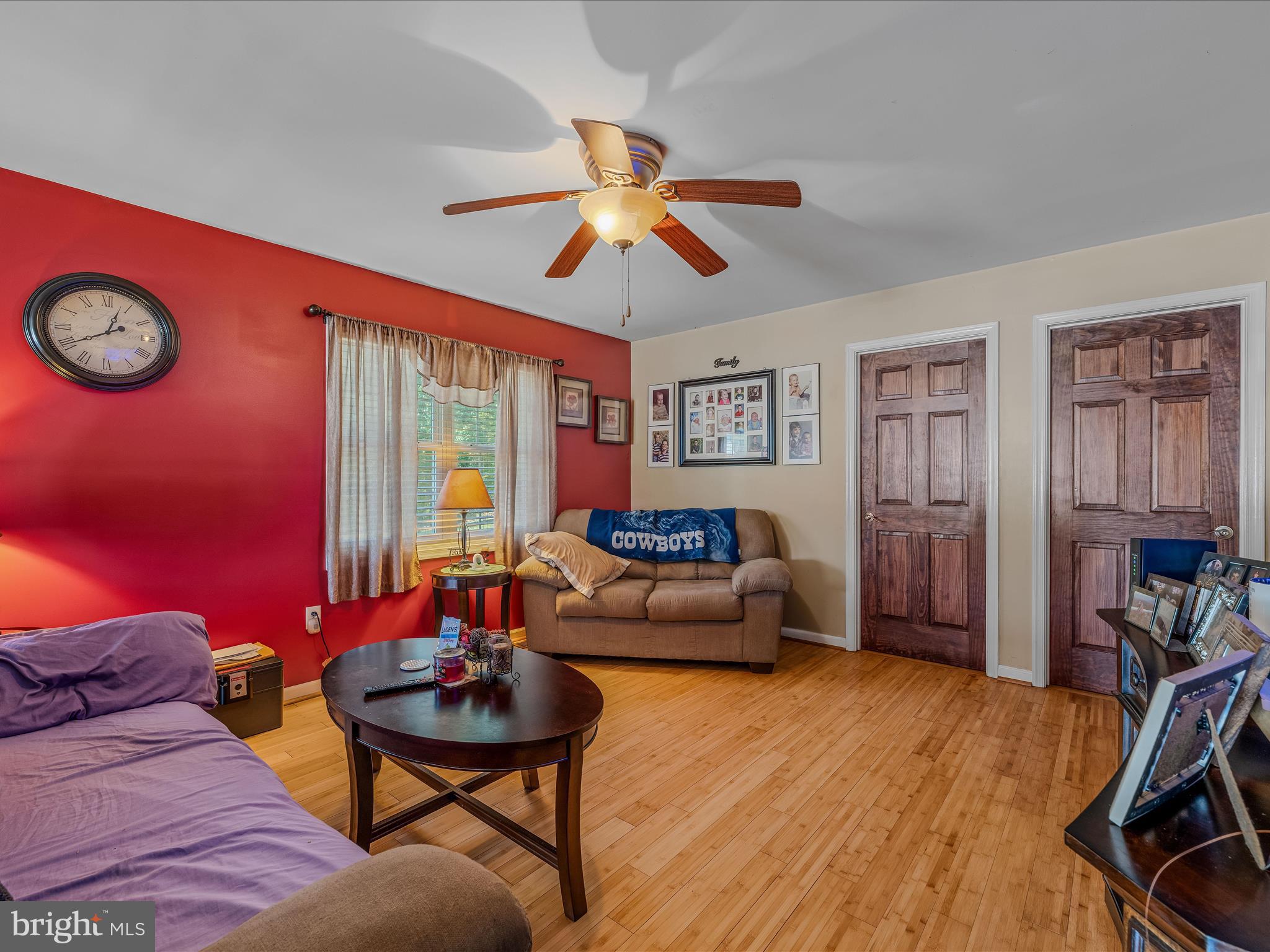 608 DeHaven Road Berkeley Springs, WV 25411 - Photo 6 of 52 a living room with furniture a ceiling fan and a window