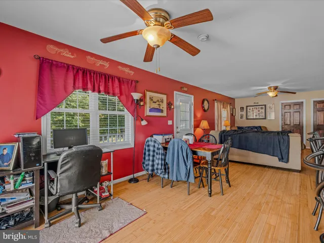 a view of a livingroom with furniture and a work space