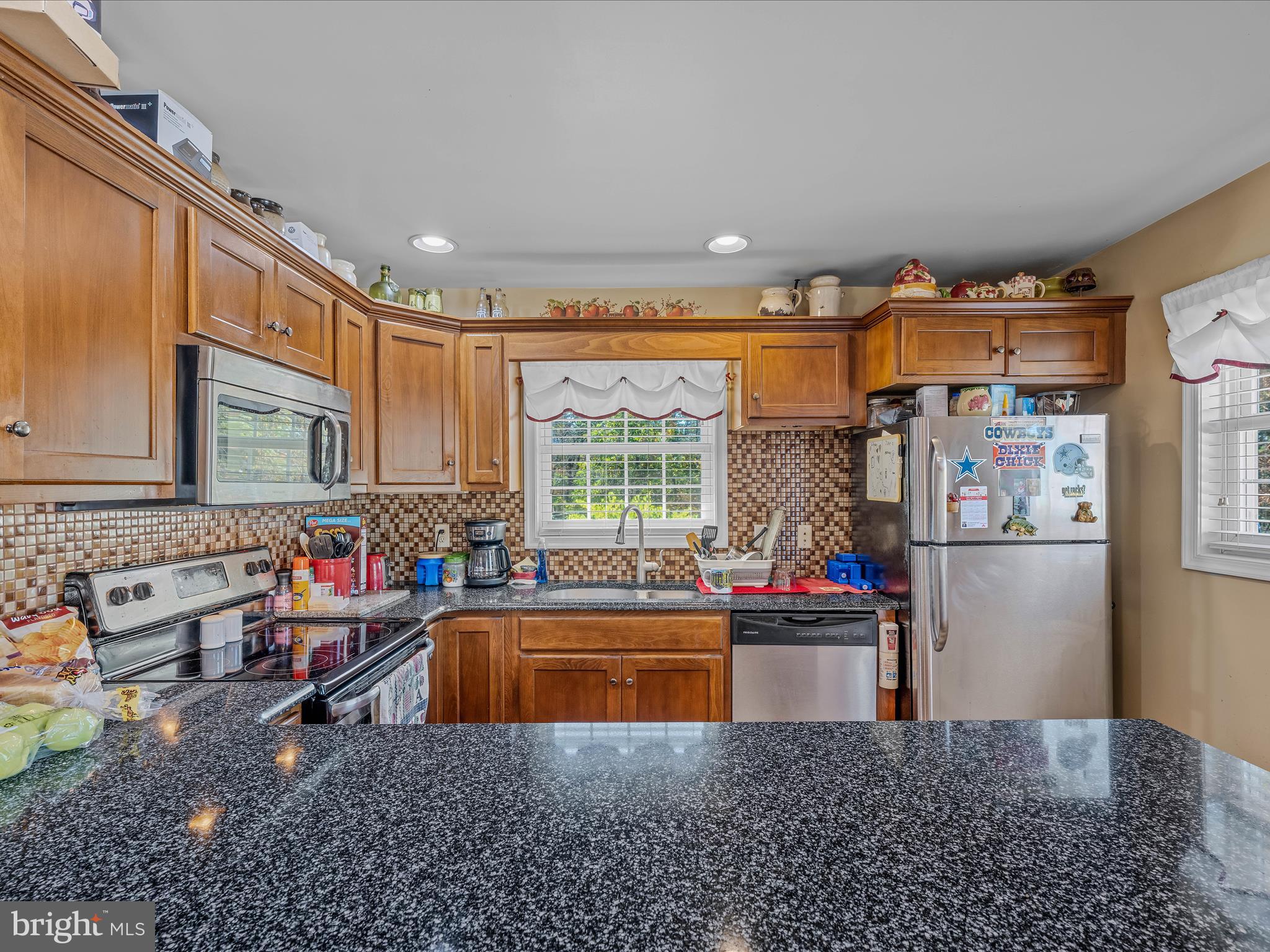 608 DeHaven Road Berkeley Springs, WV 25411 - Photo 10 of 52 a kitchen that has a sink and a refrigerator