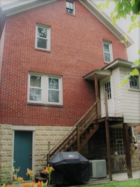 897 Malvern Road Pittsburgh, PA 15202 - Photo 6 of 25 The rear features a walk out to a level rear yard from both the main level mud room and the walk out basement