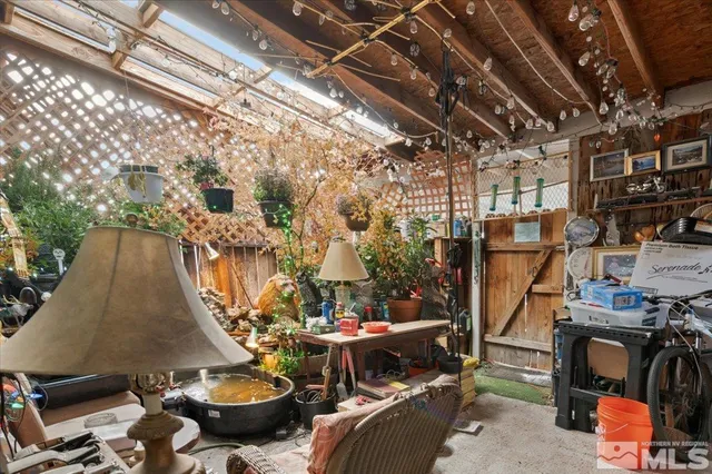 a view of a chairs and table in the patio