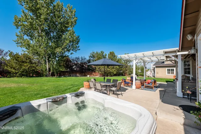 a view of a swimming pool with a patio