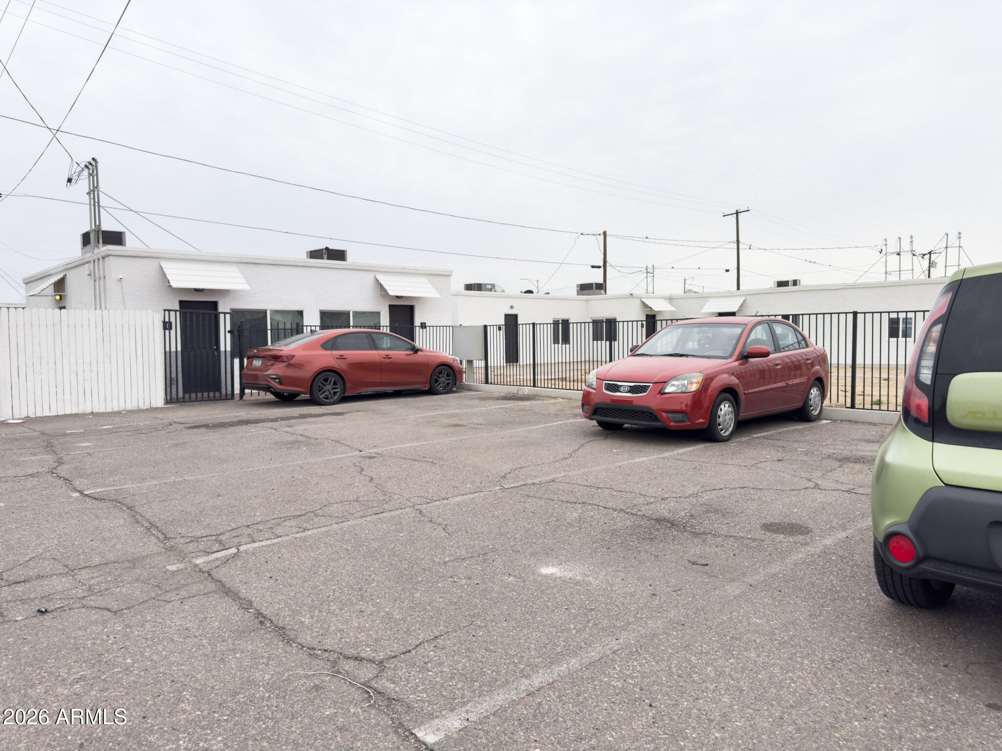 3601 West Melvin Street, Unit 7 Phoenix, AZ 85009 - Photo 14 of 26 a car parked in parking area of a building