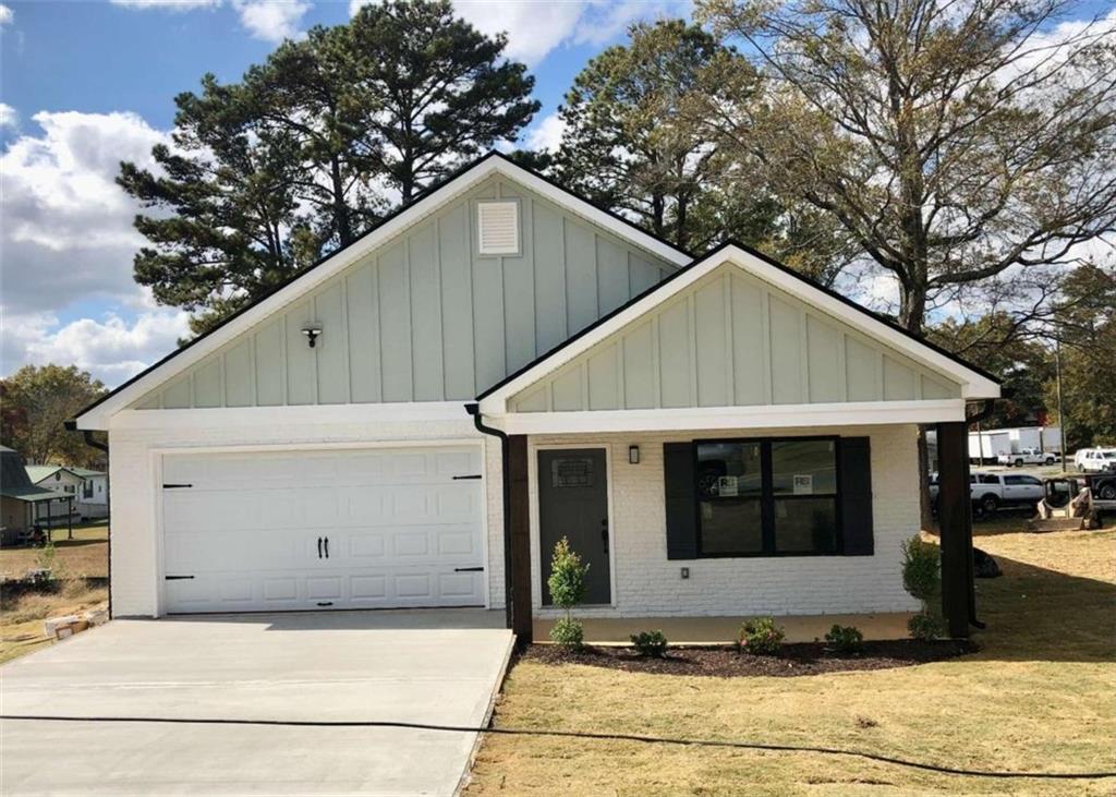 53 Lyons Drive Northwest Rome, GA 30165 - Photo 1 of 1 a house with trees in the background
