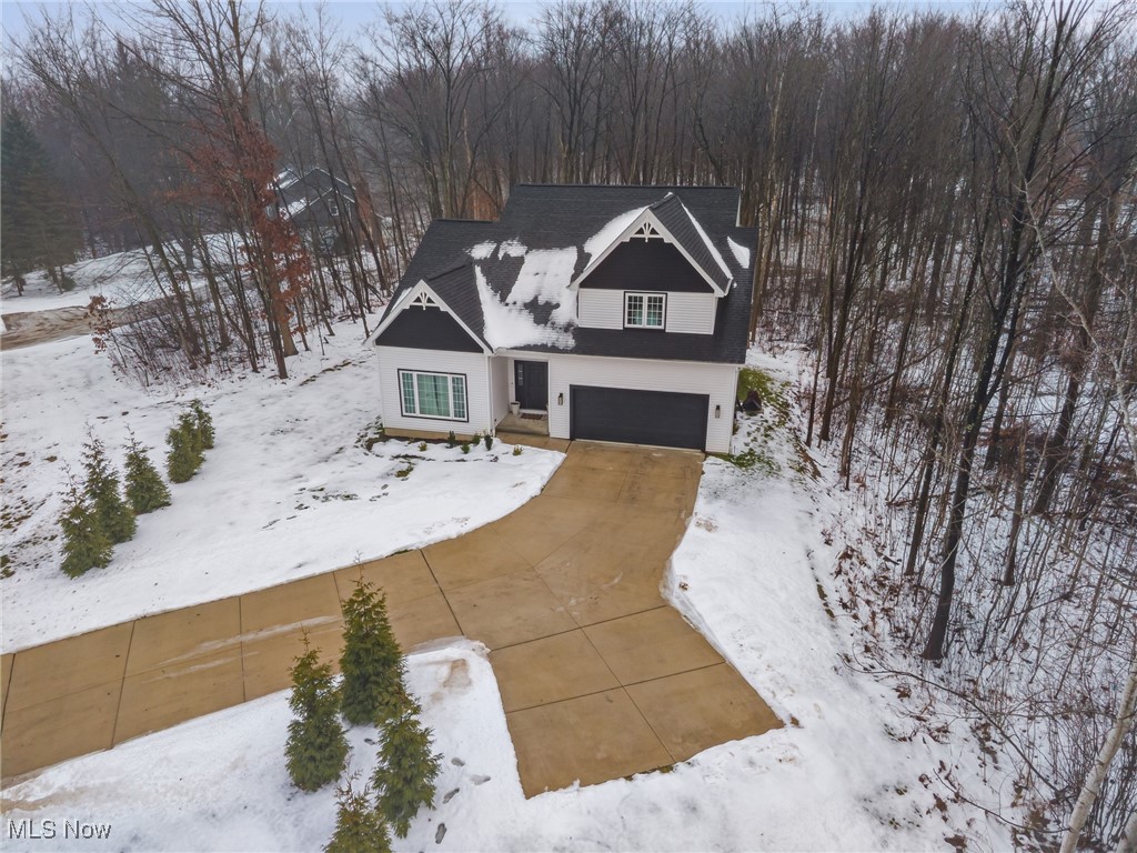 39600 Aurora Road Solon, OH 44139 - Photo 42 of 49 View of front facade with a garage and concrete driveway