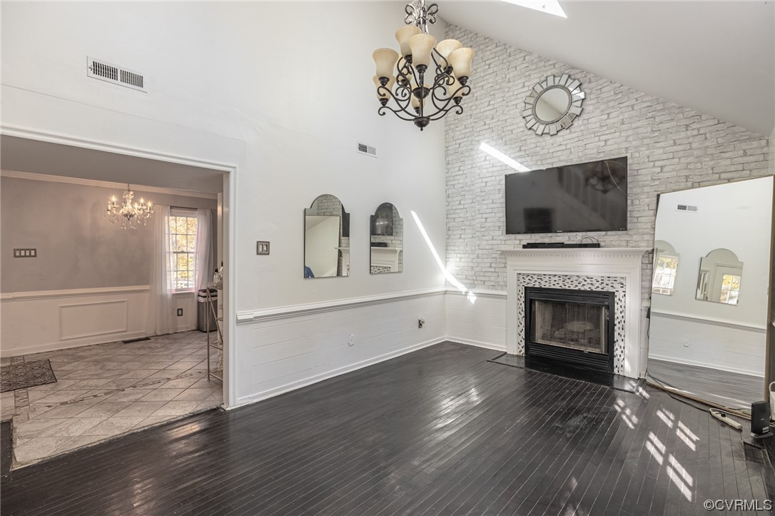 11701 Deerhurst Drive Midlothian, VA 23113 - Photo 4 of 22 a living room with a fireplace with flat screen tv and fireplace