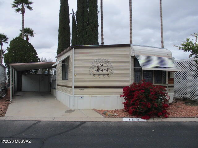 3100 South Kinney Road, Unit 193 Tucson, AZ 85713 - Photo 2 of 35 a front view of a house with entryway