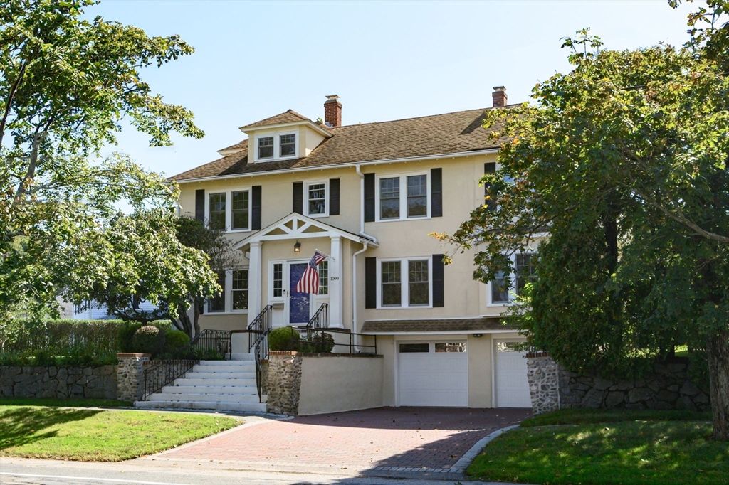 1099 Brook Road Milton, MA 02186 - Photo 1 of 41 a front view of a house with a garden