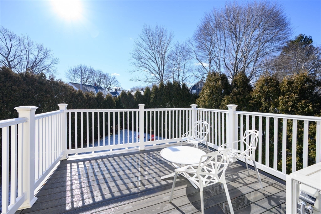 1099 Brook Road Milton, MA 02186 - Photo 23 of 41 a view of a wooden chairs and bench
