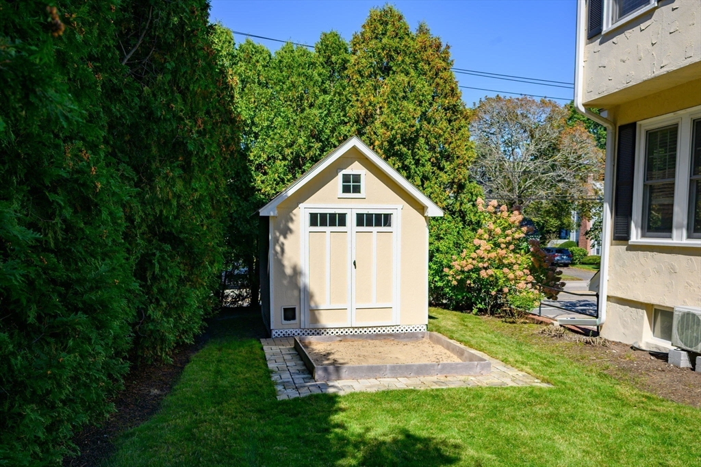1099 Brook Road Milton, MA 02186 - Photo 35 of 41 a front view of a house with garden