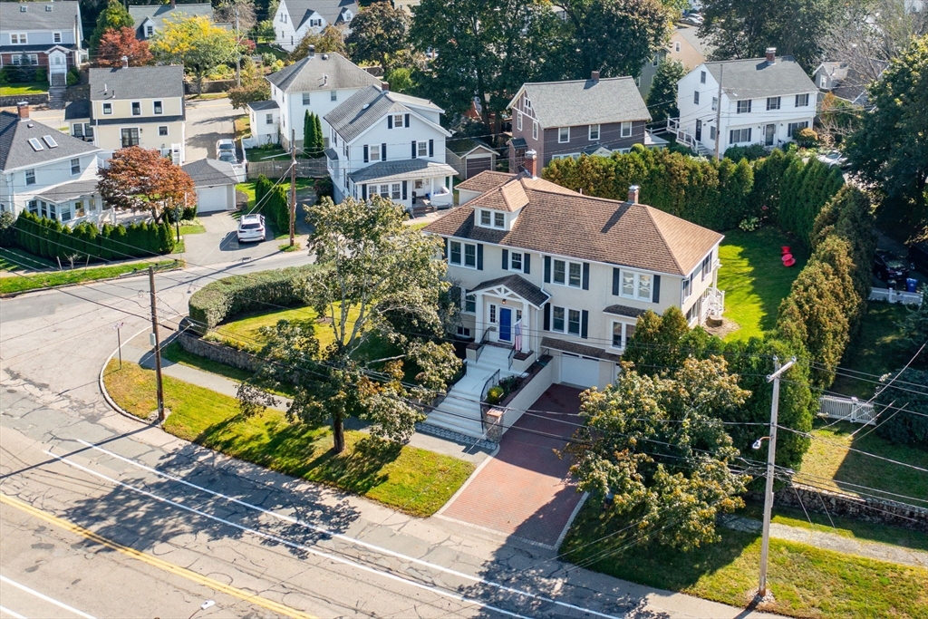 1099 Brook Road Milton, MA 02186 - Photo 36 of 41 an aerial view of a house with a swimming pool
