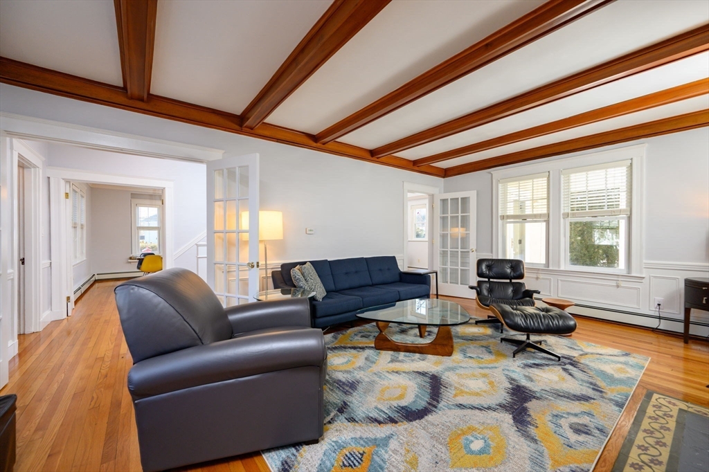 1099 Brook Road Milton, MA 02186 - Photo 4 of 41 a living room with furniture and a large window