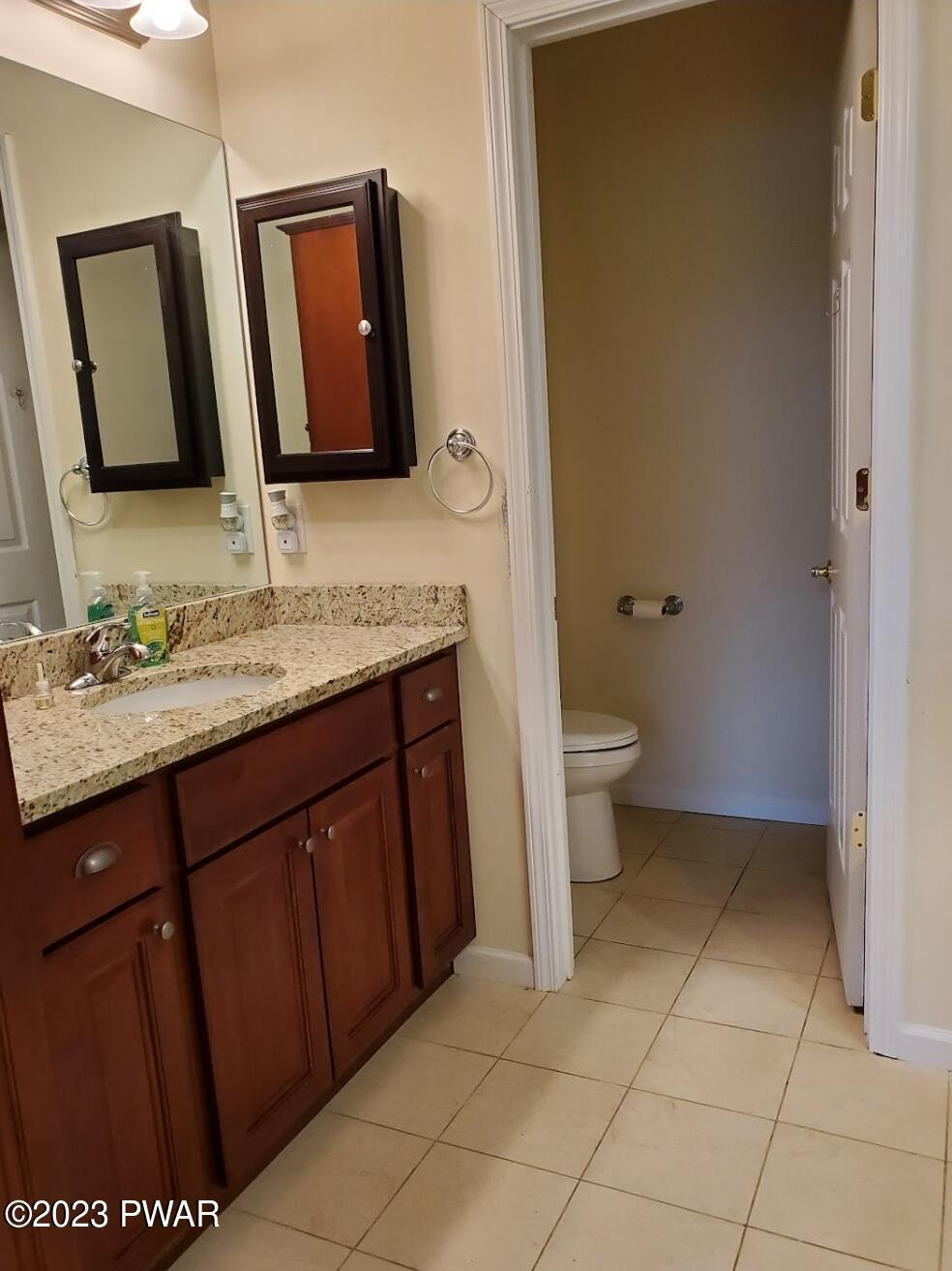 806 MacIntosh Way Matamoras, PA 18336 - Photo 27 of 53 a bathroom with a toilet sink and mirror