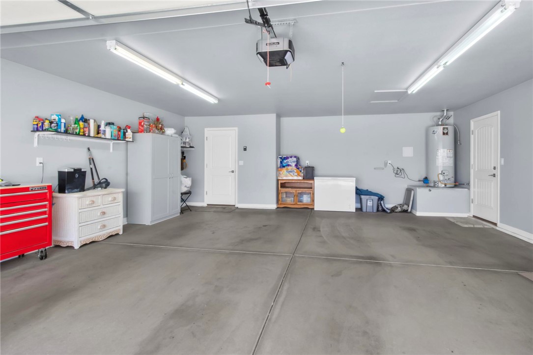 3897 Easy Street Kingman, AZ 86409 - Photo 31 of 53 a view of storage and utility room with refrigerator and ceiling fan
