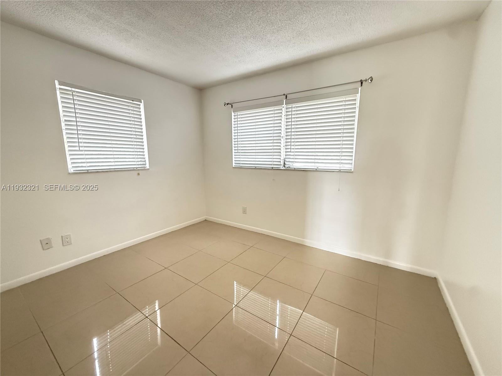Arrowhead Condominium Davie, FL 33324 - Photo 13 of 35 a view of an empty room with a window