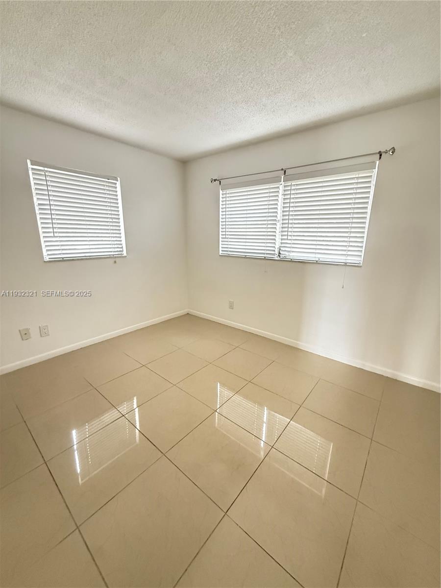 Arrowhead Condominium Davie, FL 33324 - Photo 14 of 35 a view of a room with an empty space and a window
